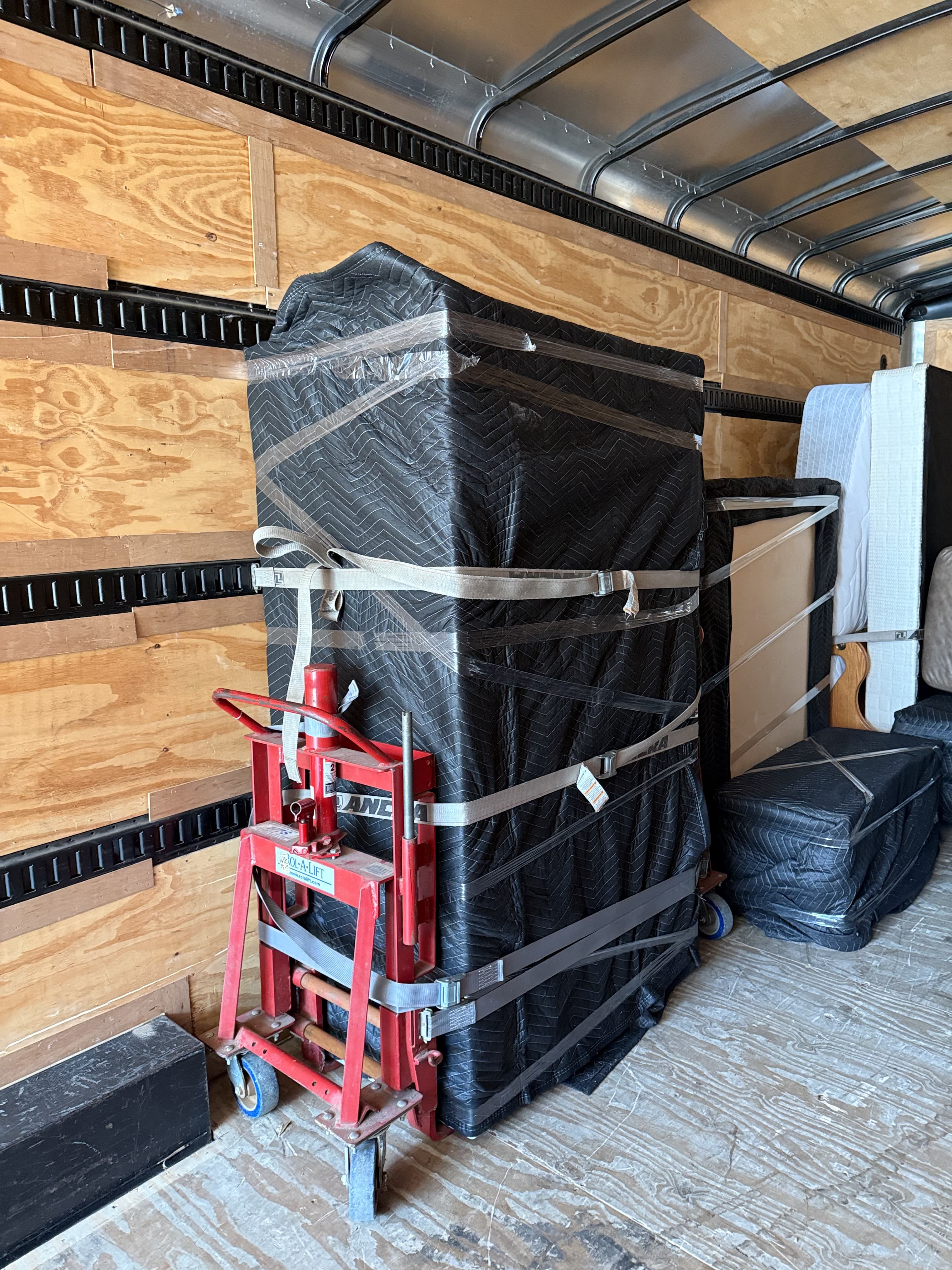 Upright Moving crew moving a heavy gun safe in North Texas